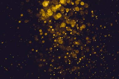 Siyah arkaplanda altın renkli ışıklar