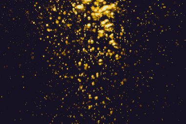 Siyah arkaplan ile soyut altın bokeh