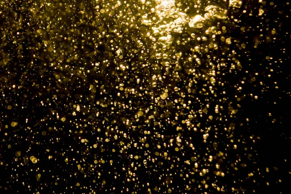 Gold Bokeh Lights Water Black Background — Stock Photo, Image