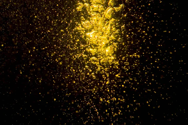Bokeh Ouro Luzes Água Fundo Preto — Fotografia de Stock