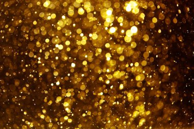 Siyah arkaplan ile neon ışıklar tarafından oluşturulan klasik altın bokeh