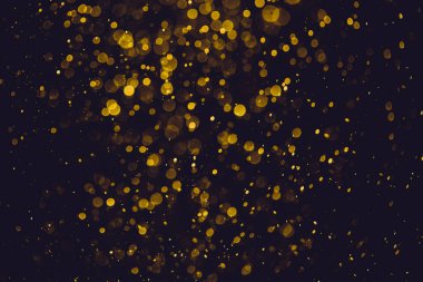 Siyah arkaplanı olan klasik soyut altın bokeh