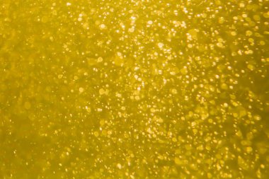 Sevgililer Günü için sprey suyun sebep olduğu altın rengi bokeh soyut arkaplan