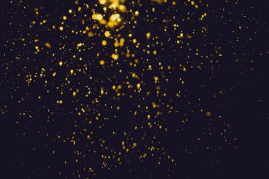 Siyah arkaplan ile soyut altın bokeh