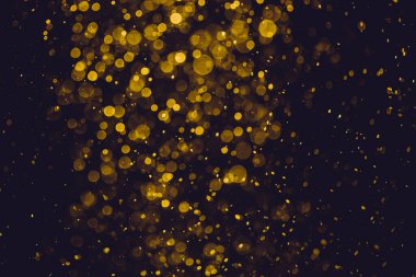 Siyah arkaplanı olan klasik soyut altın bokeh