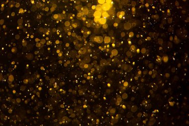 Siyah arkaplan ile altın soyut bokeh