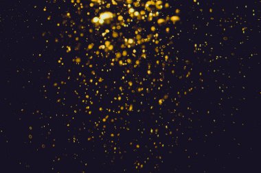 Siyah arkaplan ile soyut altın bokeh