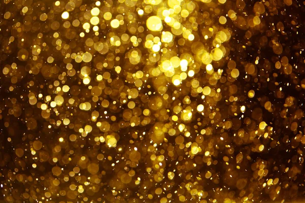 Vintage gold bokeh created by neon lights fwith black background