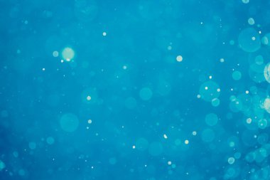 Soyut bulanık mavi bokeh daireleri renkli sanat ve tasarım arka planı için kullanılır