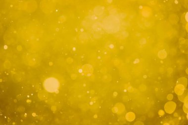 Soyut bulanık altın bokeh çemberleri renkli sanat ve tasarım arka planı için kullanılır
