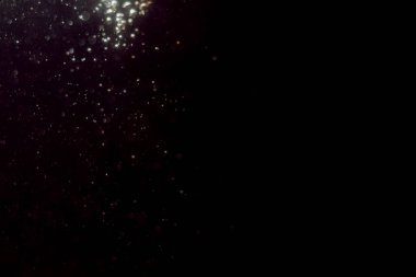 Soyut glitter bokeh siyah arka plan üzerine