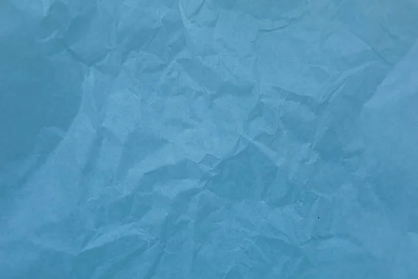 Blue paper with wrinkles texture background