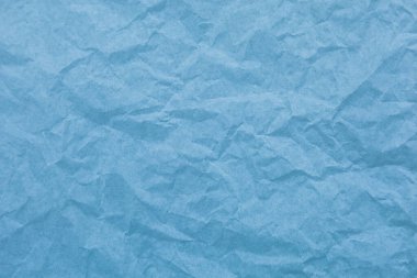 Kırışıklık arkaplanı olan mavi kağıt
