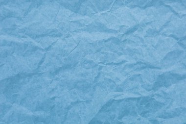 Kırışıklık arkaplanı olan mavi kağıt