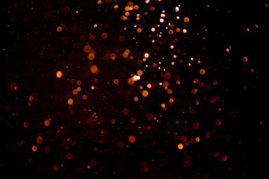 Siyah arkaplan ile soyut altın bokeh
