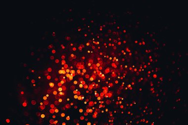 Siyah arkaplan ile soyut kırmızı bokeh dokusu