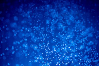 Soyut koyu mavi noel sim ışıkları bokeh arkaplanının odak noktasını kaldırdı