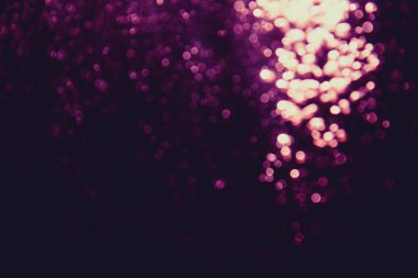 Siyah arkaplanı olan soyut pembe bokeh lüksü