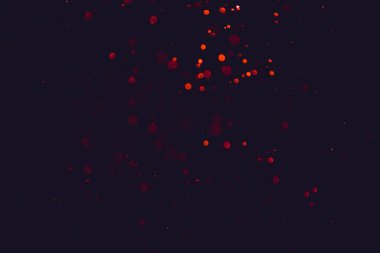 Siyah arkaplanda kırmızı ışık bokeh