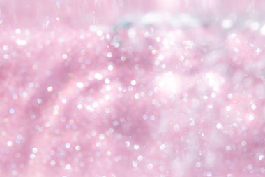 Pembe soyut ışıltılar ya da parlak ışıklar Odaklanmış daireler bokeh arkaplan