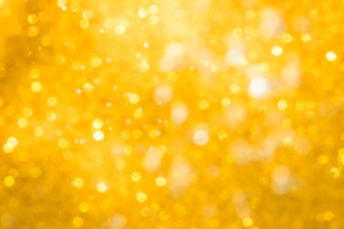 Altın soyut ışıltılar ya da parıltılı ışıklar Odaklanmamış daireler bokeh arkaplanı