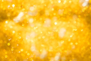 Altın soyut ışıltılar ya da parıltılı ışıklar Odaklanmamış daireler bokeh arkaplanı