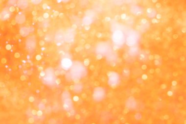 Turuncu soyut ışıltılar ya da parıltılı ışıklar Odaklanmamış daireler bokeh arkaplanı