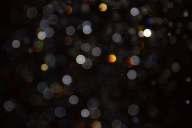 Siyah arka planda Bokeh bulanıklığı lüks, ışıltılı, uygun taşıma lüksü gibi görünüyor