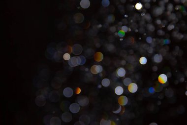 Siyah arka planda Bokeh bulanıklığı lüks, ışıltılı, uygun taşıma lüksü gibi görünüyor