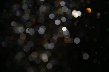 Siyah arka planda Bokeh bulanıklığı lüks, ışıltılı, uygun taşıma lüksü gibi görünüyor