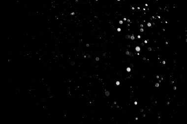 Siyah arkaplan üzerindeki ışık dokusunun soyut siyah bokeh 'i