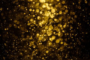 Görünür altın noktalı bulanık fotoğraf ışıl ışıl parlıyor. Duvar kağıdı olarak kullanılabilecek kadar lüks görünüyor.