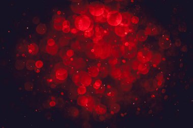 Görünür kırmızı noktalı bulanık fotoğraf, ışıl ışıl parlıyor. Duvar kağıdı olarak kullanılabilecek kadar lüks görünüyor.