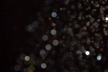 Siyah arka planda Bokeh bulanıklığı lüks, ışıltılı, uygun taşıma lüksü gibi görünüyor