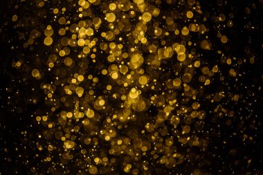 Görünür altın noktalı bulanık fotoğraf ışıl ışıl parlıyor. Duvar kağıdı olarak kullanılabilecek kadar lüks görünüyor.