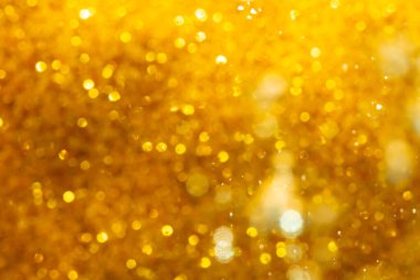 Arkaplan için siyah kullanımda altın bokeh bulanıklığı giderici