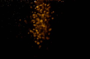 Görünür altın noktalı bulanık fotoğraf ışıl ışıl parlıyor. Lüks ve zevki gösteren bir duvar kağıdı olarak kullanılabilecek kadar lüks görünüyor..