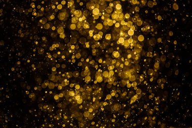 Görünür altın noktalı bulanık fotoğraf ışıl ışıl parlıyor. Duvar kağıdı olarak kullanılabilecek kadar lüks görünüyor.