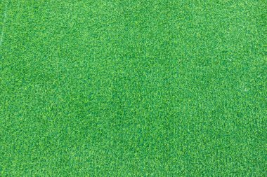 Çim bahçesinin üst manzarası bakması ferahlatıcı. Fotoğraf için yeşil arkaplan oluşturmak için kullanılan yeşil çimen dokusu arka plan fikirleri