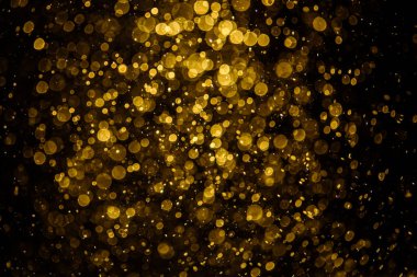 Görünür altın noktalı bulanık fotoğraf ışıl ışıl parlıyor. Duvar kağıdı olarak kullanılabilecek kadar lüks görünüyor.