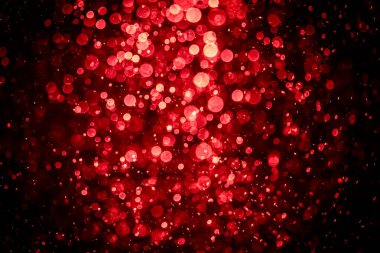 Görünür kırmızı noktalı bulanık fotoğraf, ışıl ışıl parlıyor. Duvar kağıdı olarak kullanılabilecek kadar lüks görünüyor.