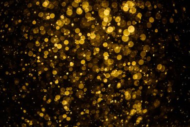 Görünür altın noktalı bulanık fotoğraf ışıl ışıl parlıyor. Duvar kağıdı olarak kullanılabilecek kadar lüks görünüyor.
