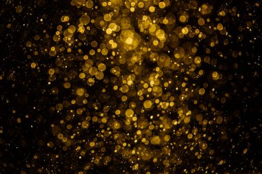 Görünür altın noktalı bulanık fotoğraf ışıl ışıl parlıyor. Duvar kağıdı olarak kullanılabilecek kadar lüks görünüyor.