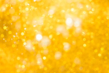 Altın soyut ışıltılar ya da parıltılı ışıklar Odaklanmamış daireler bokeh arkaplanı