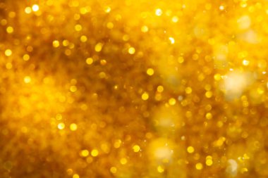 Arkaplan için siyah kullanımda altın bokeh bulanıklığı giderici