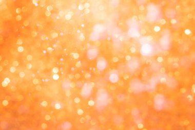 Turuncu soyut ışıltılar ya da parıltılı ışıklar Odaklanmamış daireler bokeh arkaplanı