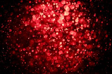 Görünür kırmızı noktalı bulanık fotoğraf, ışıl ışıl parlıyor. Duvar kağıdı olarak kullanılabilecek kadar lüks görünüyor.