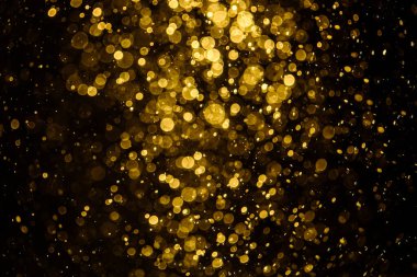 Görünür altın noktalı bulanık fotoğraf ışıl ışıl parlıyor. Duvar kağıdı olarak kullanılabilecek kadar lüks görünüyor.