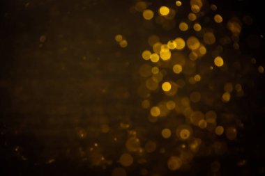 Görünür altın noktalı bulanık fotoğraf ışıl ışıl parlıyor. Lüks ve zevki gösteren bir duvar kağıdı olarak kullanılabilecek kadar lüks görünüyor..