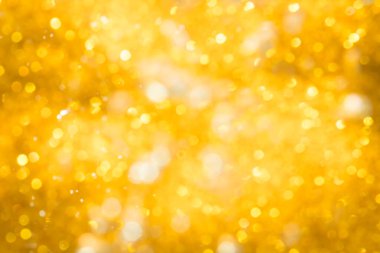 Altın soyut ışıltılar ya da parıltılı ışıklar Odaklanmamış daireler bokeh arkaplanı